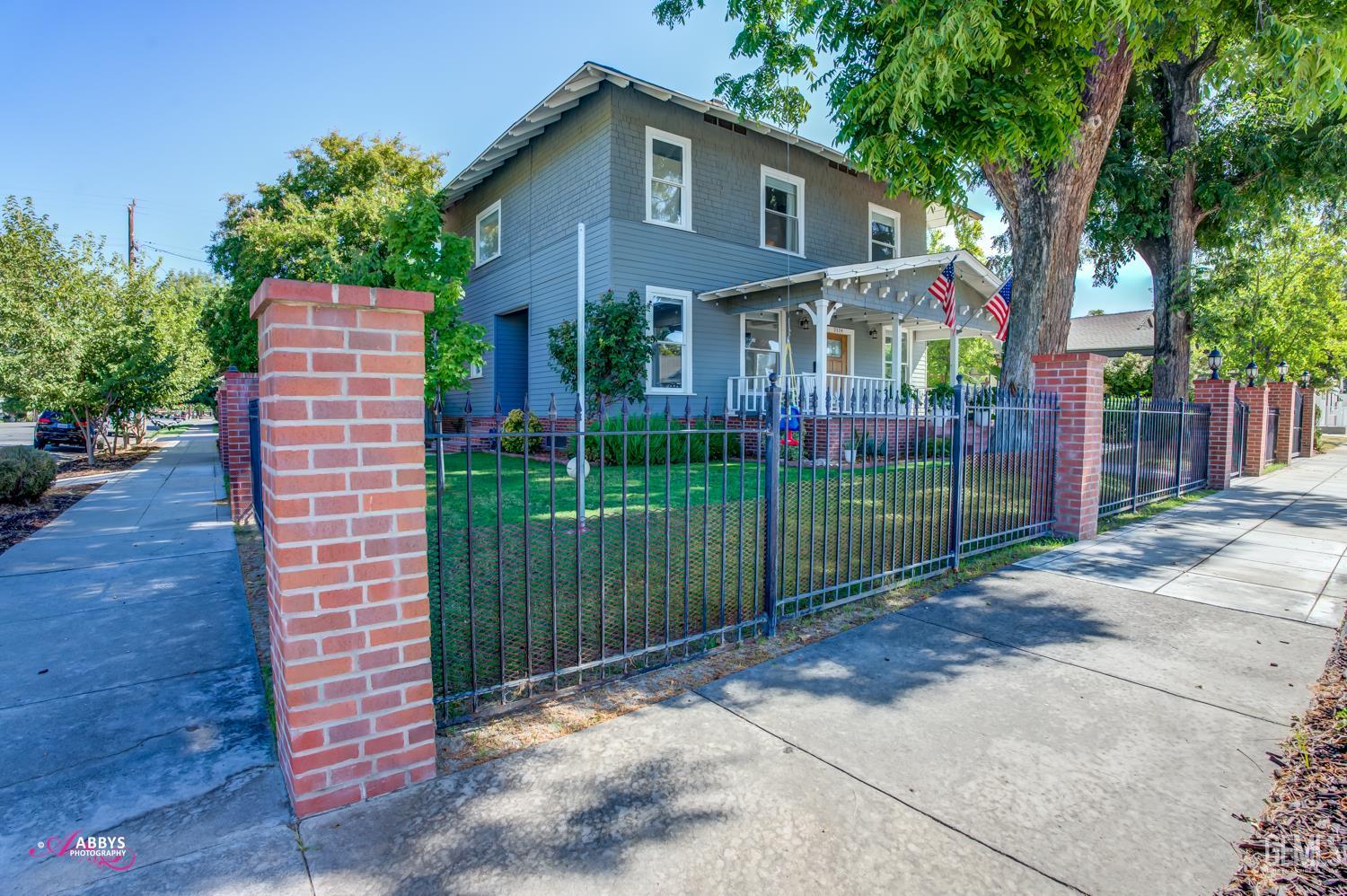 Undisclosed Address Bakersfield, CA 93301 - Photo 4 of 58 a view of a house with a yard and plants