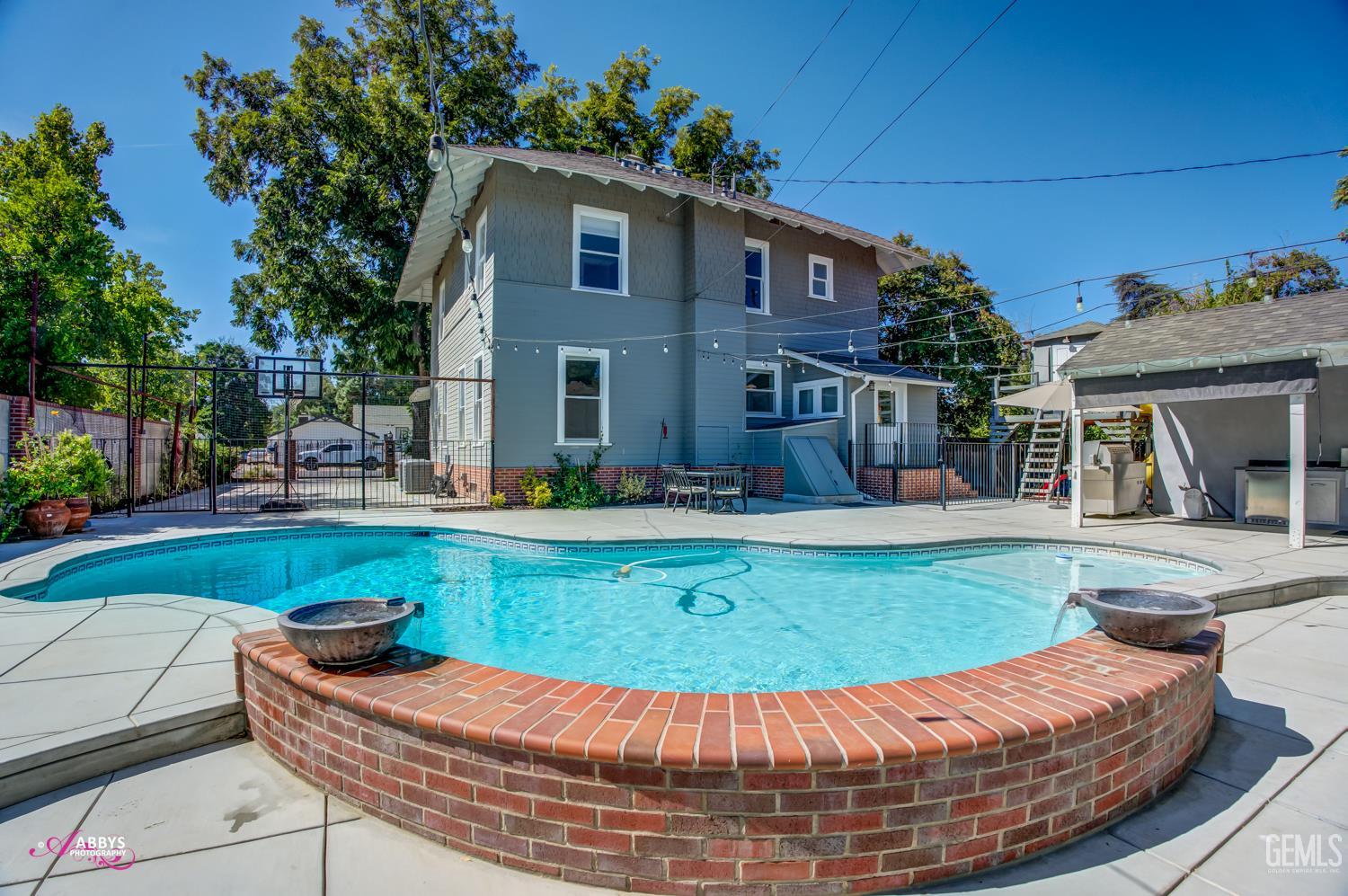 Undisclosed Address Bakersfield, CA 93301 - Photo 43 of 58 a view of a house with swimming pool and sitting area