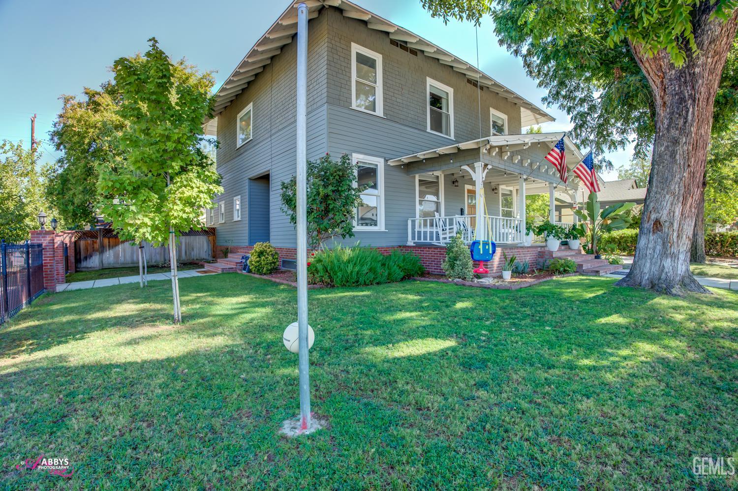 Undisclosed Address Bakersfield, CA 93301 - Photo 6 of 58 a front view of house with yard and outdoor seating