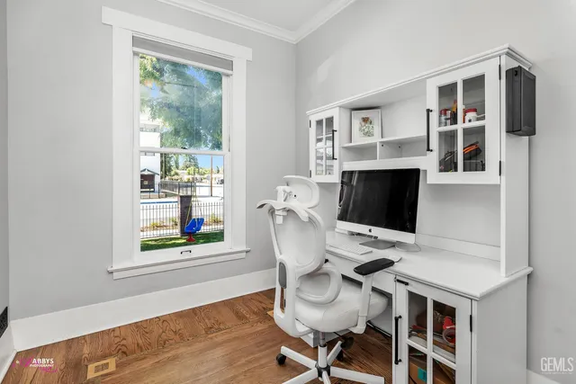 a workspace with furniture and wooden floor