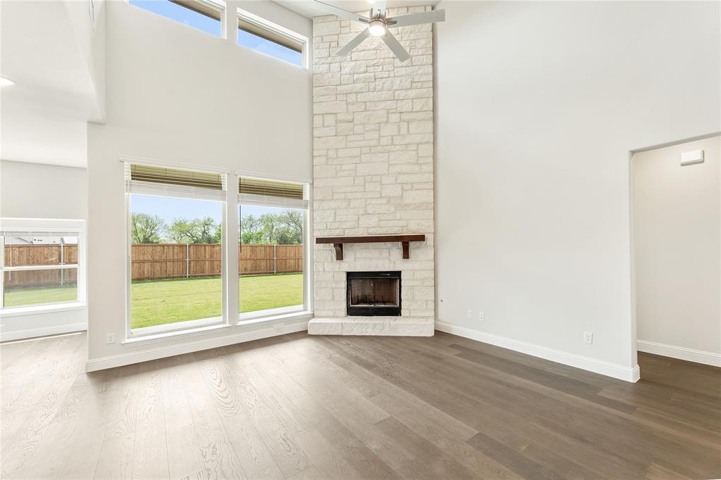 3002 Wild River Road Melissa, TX 75454 - Photo 11 of 36 a view of an empty room with wooden floor and a window