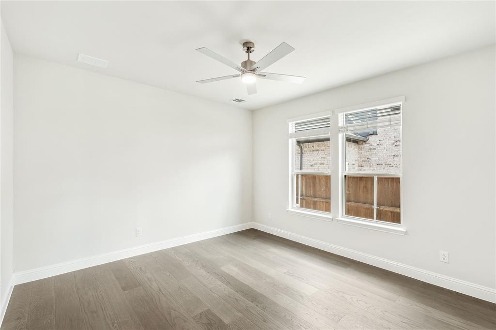 3002 Wild River Road Melissa, TX 75454 - Photo 12 of 36 an empty room with windows and fan