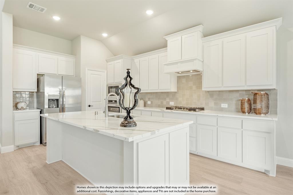 3002 Wild River Road Melissa, TX 75454 - Photo 15 of 39 a kitchen with kitchen island granite countertop a sink cabinets and stainless steel appliances