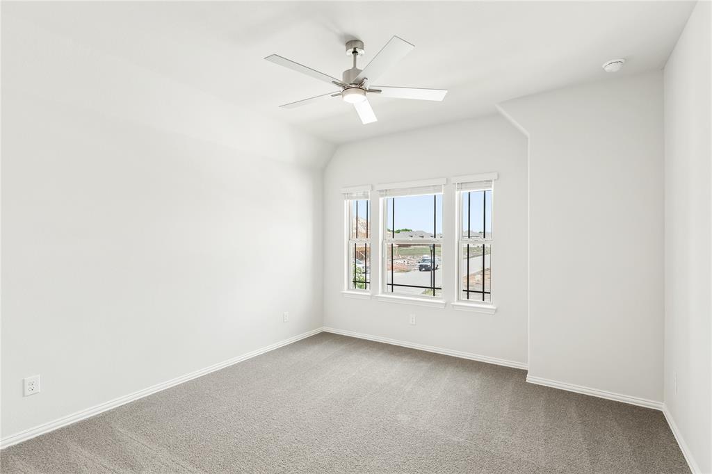 3002 Wild River Road Melissa, TX 75454 - Photo 27 of 36 an empty room with a window and a fan