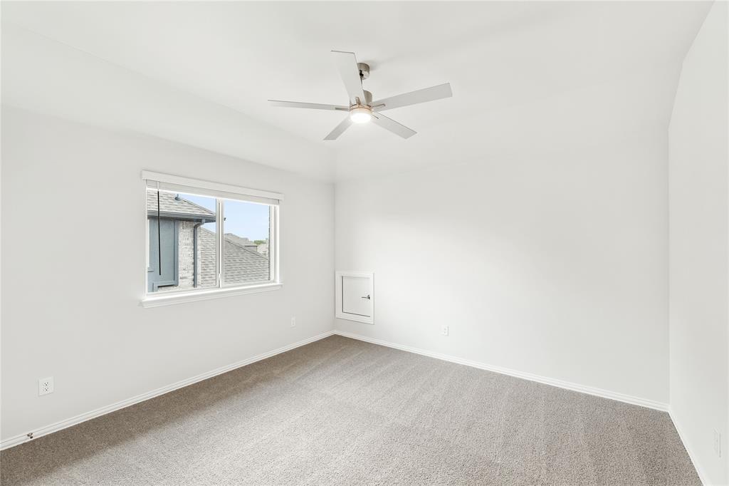 3002 Wild River Road Melissa, TX 75454 - Photo 32 of 36 an empty room with a window and a fan
