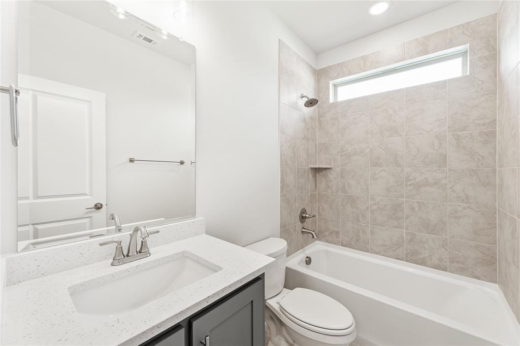 3002 Wild River Road Melissa, TX 75454 - Photo 7 of 36 a bathroom with a sink a toilet and a bathtub