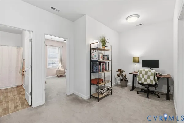 a bedroom with furniture and a window