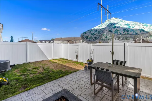 a backyard of a house with outdoor seating