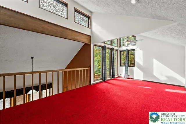 a view of a patio with a table and chairs