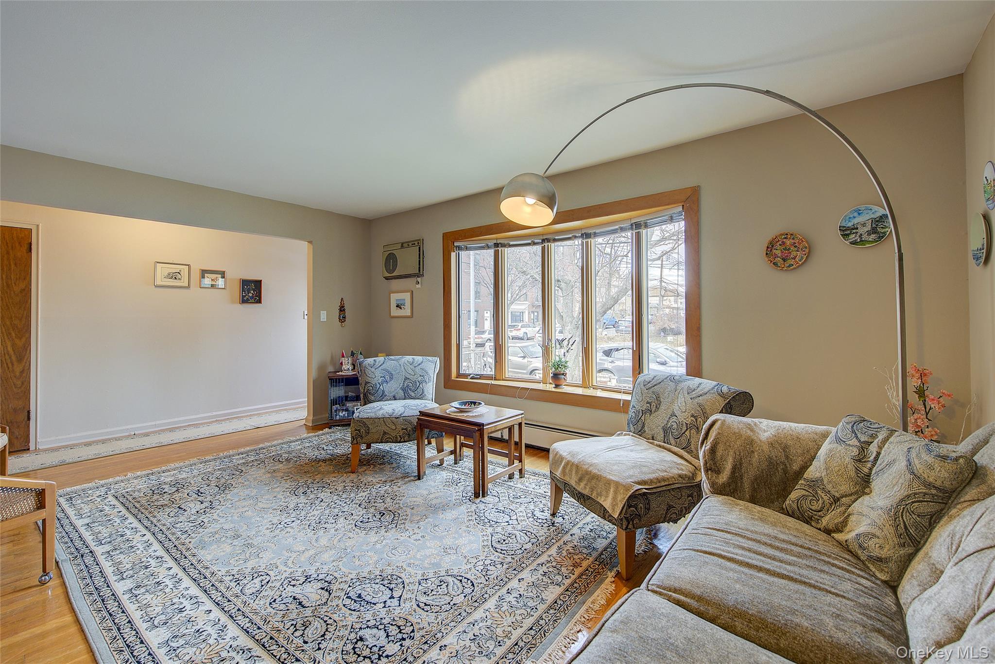 163-02 45th Avenue Queens, NY 11358 - Photo 2 of 35 Living room with light wood-type flooring and baseboards
