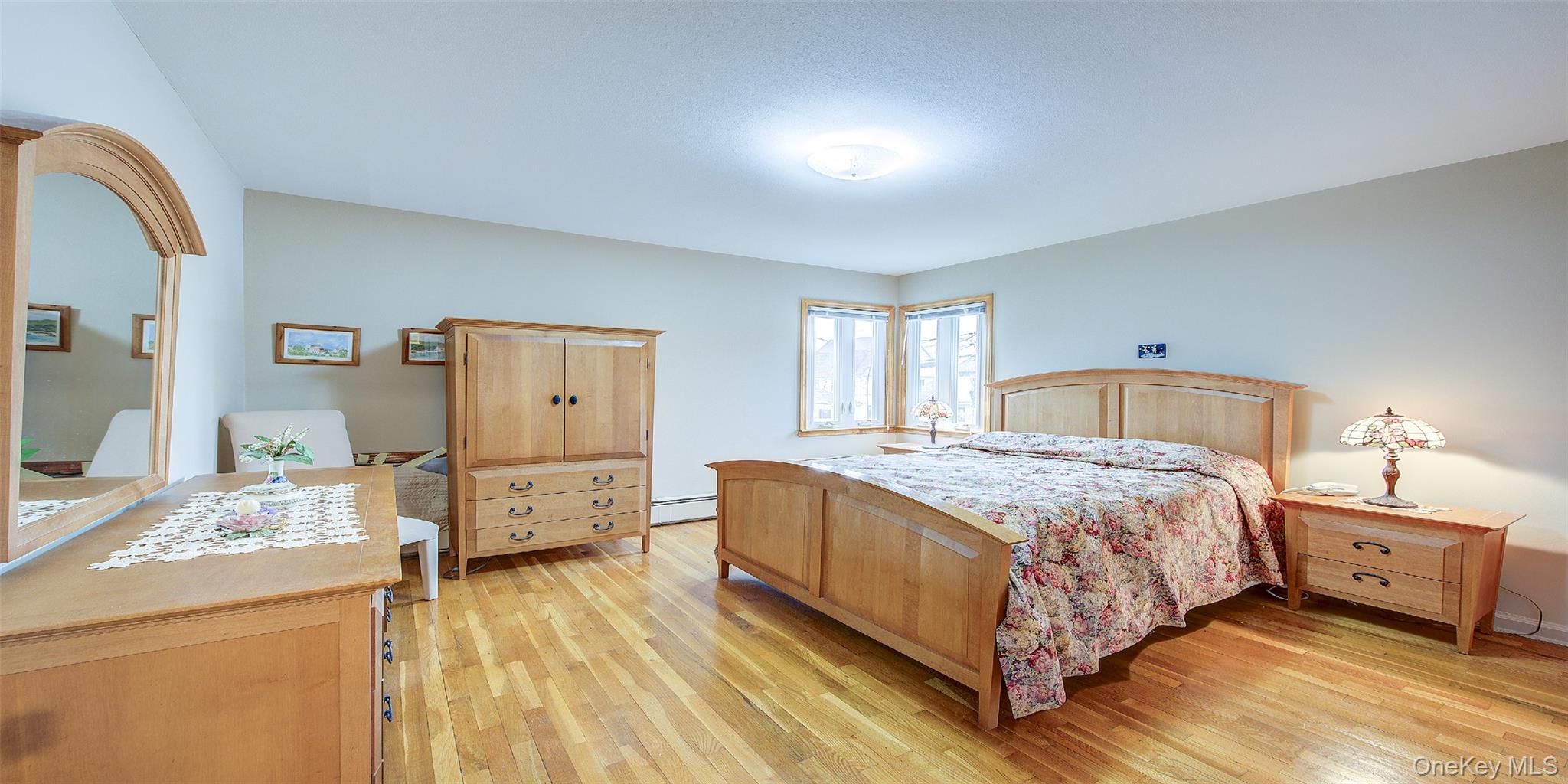 163-02 45th Avenue Queens, NY 11358 - Photo 26 of 35 Bedroom with light wood-style floors and baseboard heating