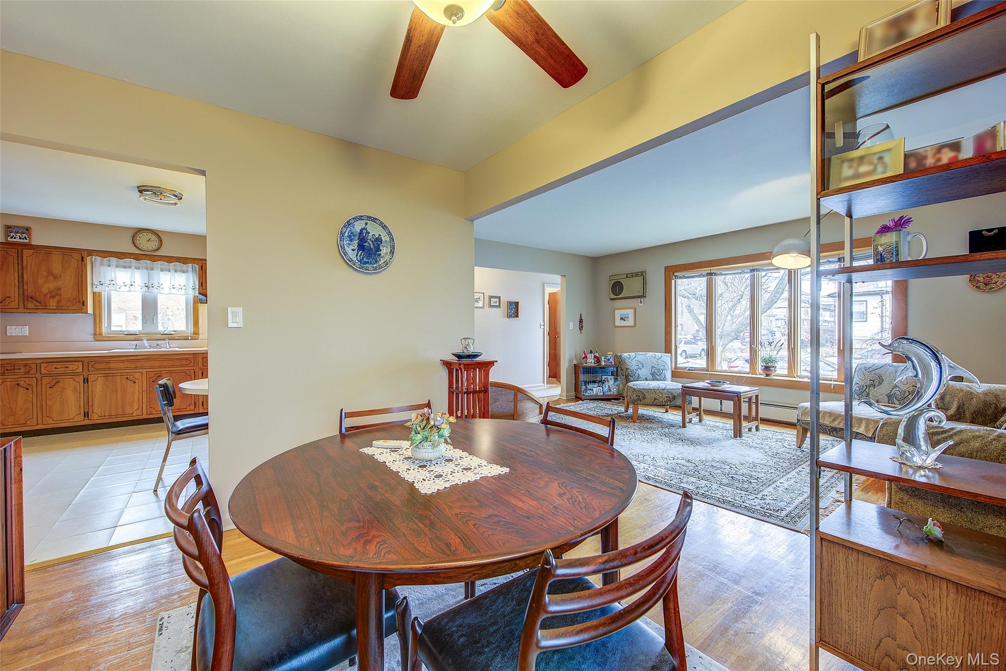 163-02 45th Avenue Queens, NY 11358 - Photo 3 of 35 Dining space with plenty of natural light, light wood-style flooring, and a ceiling fan