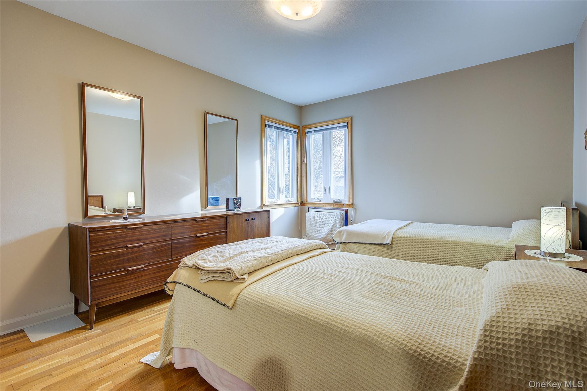 163-02 45th Avenue Queens, NY 11358 - Photo 31 of 35 Bedroom with light wood-style flooring and baseboards