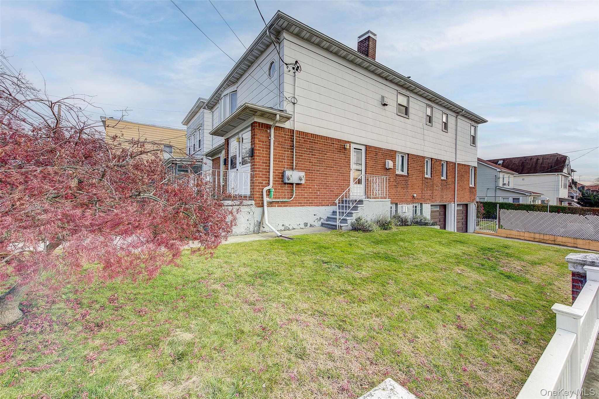 163-02 45th Avenue Queens, NY 11358 - Photo 34 of 35 Back of house featuring a chimney and brick siding
