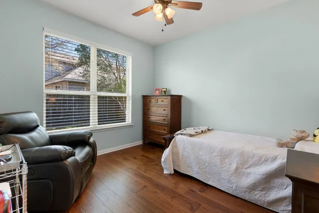a bedroom with furniture and a window