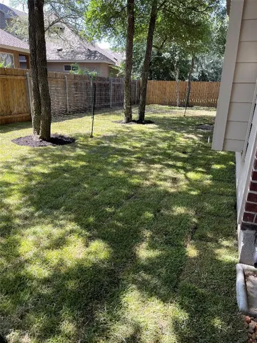 a backyard of a house with lots of green space