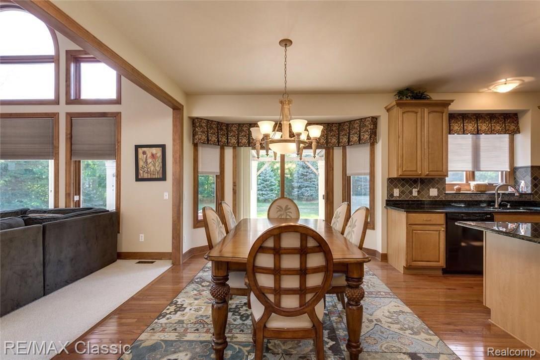 48518 Inveraray Road Canton, MI 48188 - Photo 16 of 31 The casual dining area has a bay doorwall to the patio.