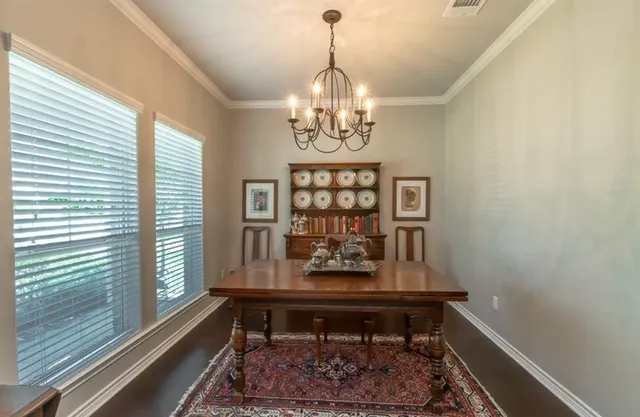 a view of a room with furniture and window