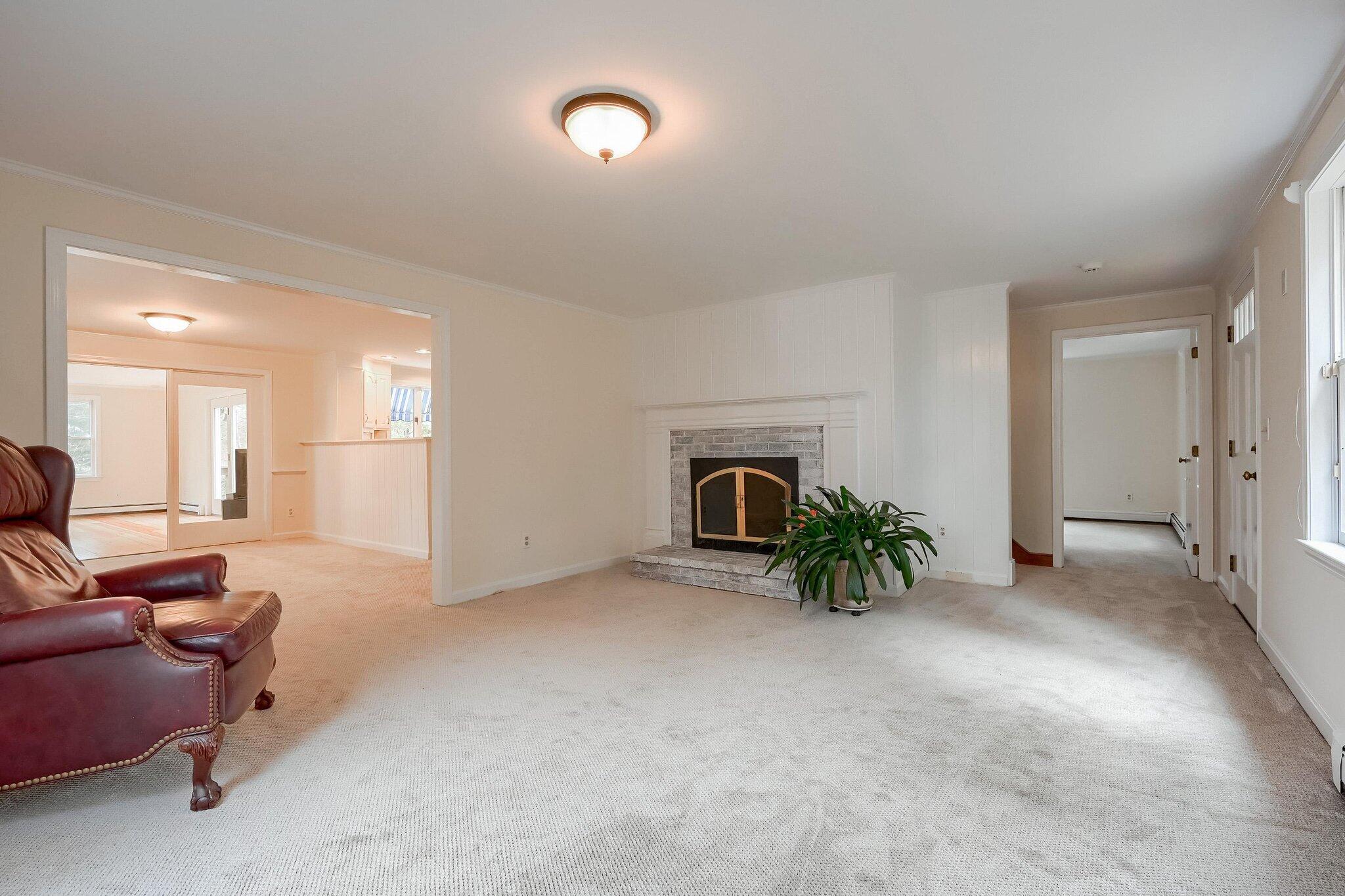 40 Barley Neck Road Orleans, MA 02653 - Photo 17 of 51 a view of livingroom with furniture and a fireplace