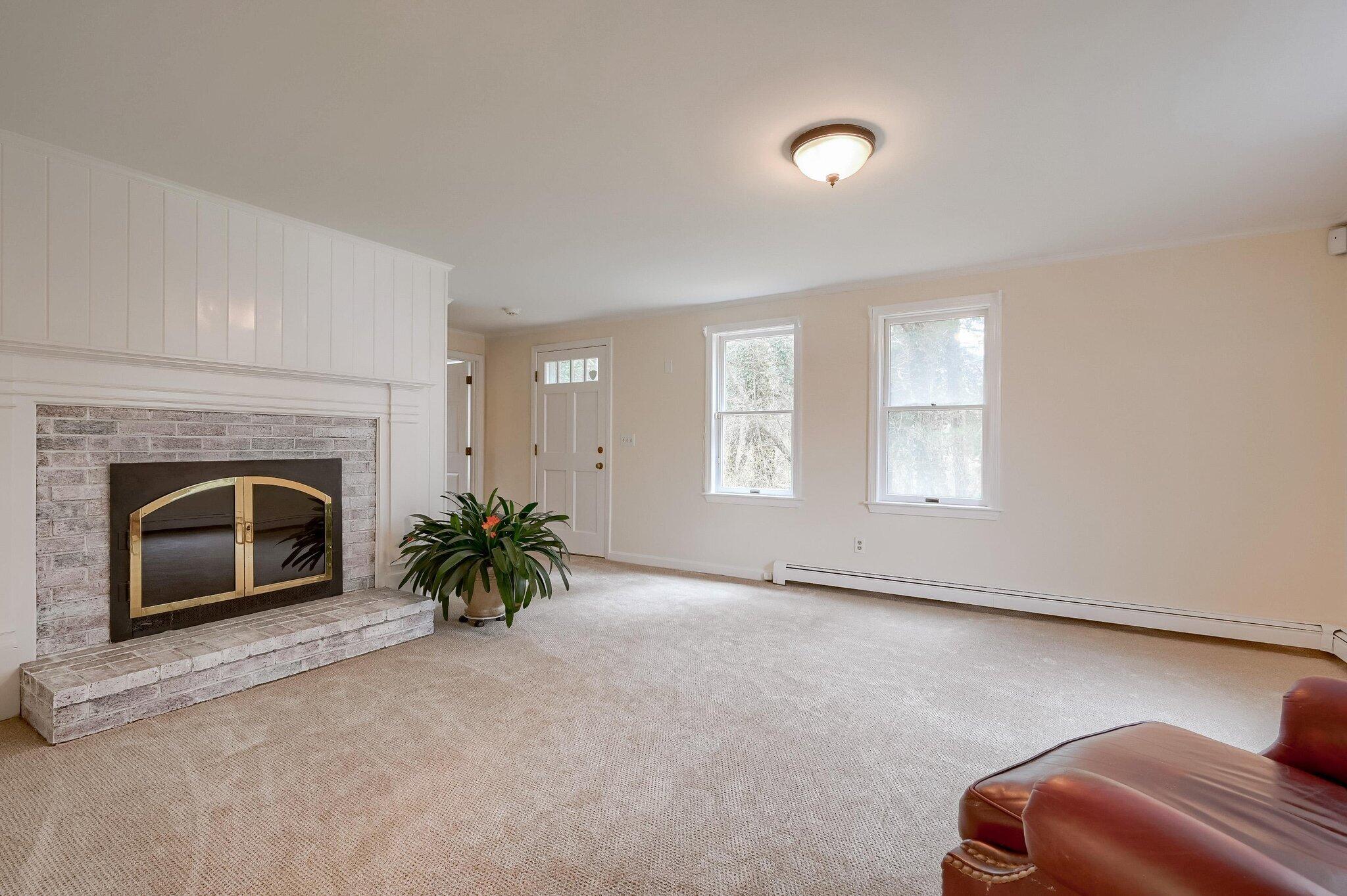 40 Barley Neck Road Orleans, MA 02653 - Photo 18 of 51 a view of a livingroom with a fireplace and window