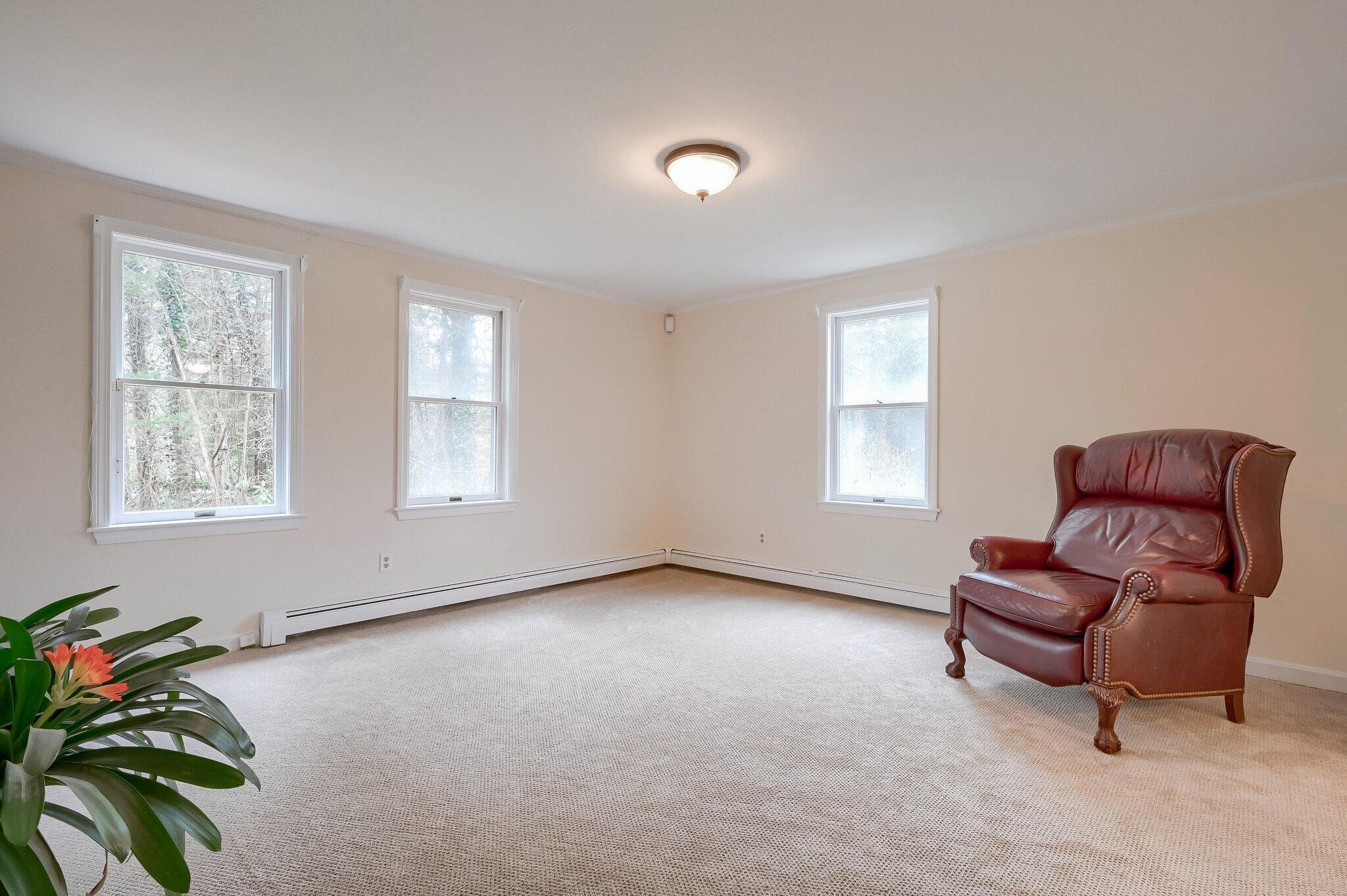 40 Barley Neck Road Orleans, MA 02653 - Photo 19 of 51 a living room with furniture and a window