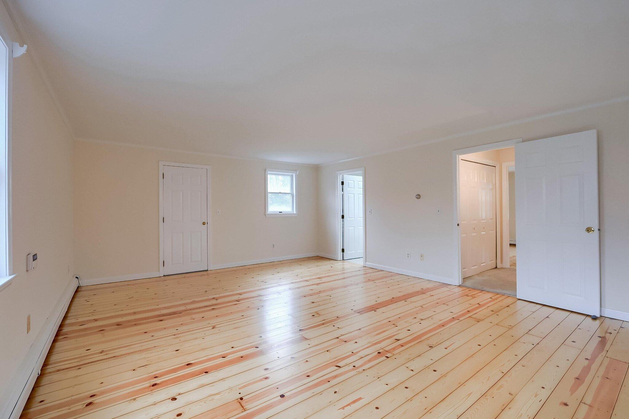 40 Barley Neck Road Orleans, MA 02653 - Photo 20 of 51 a view of empty room with wooden floor and fan
