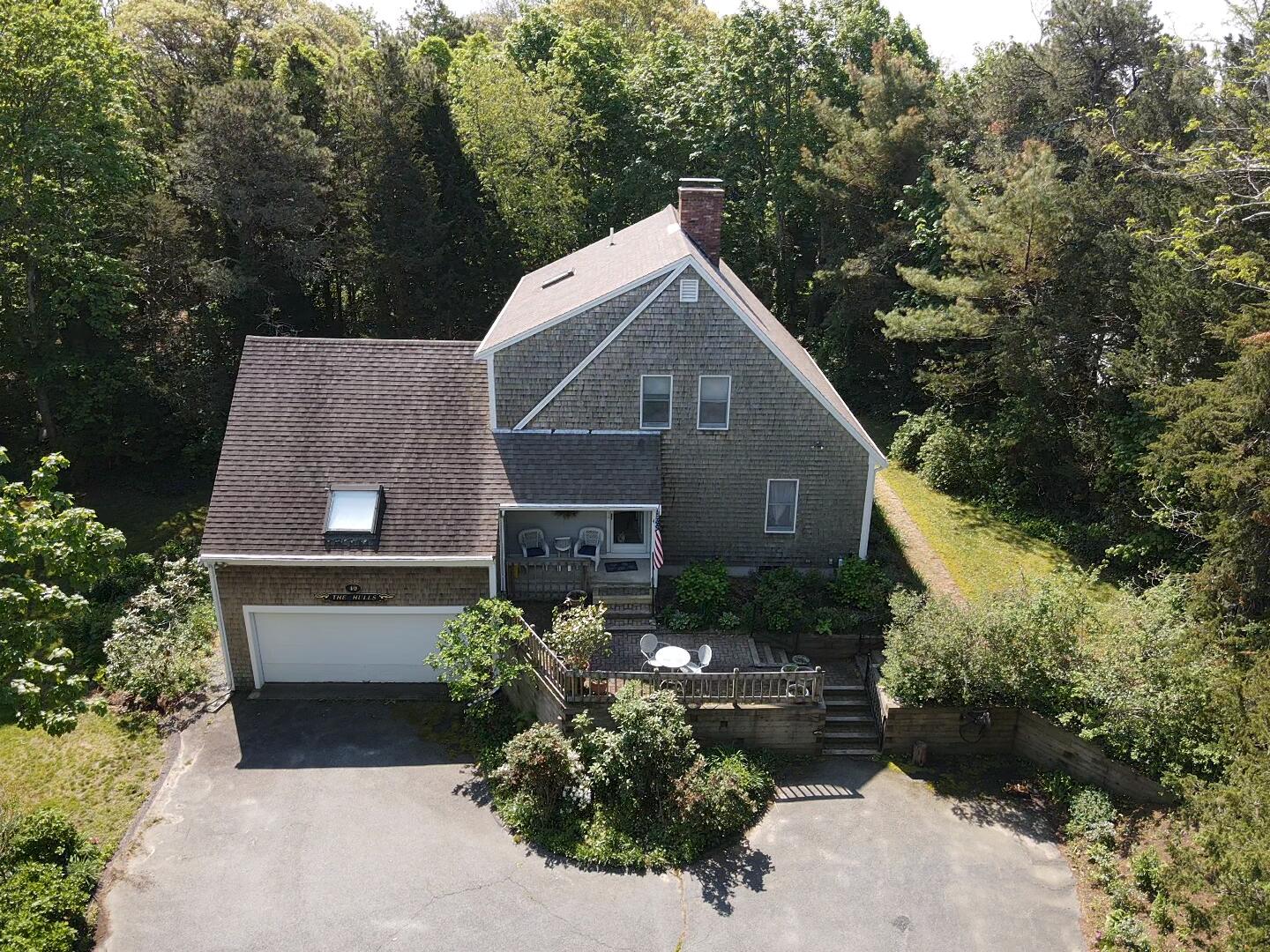 40 Barley Neck Road Orleans, MA 02653 - Photo 2 of 51 a aerial view of a house with a yard and large trees