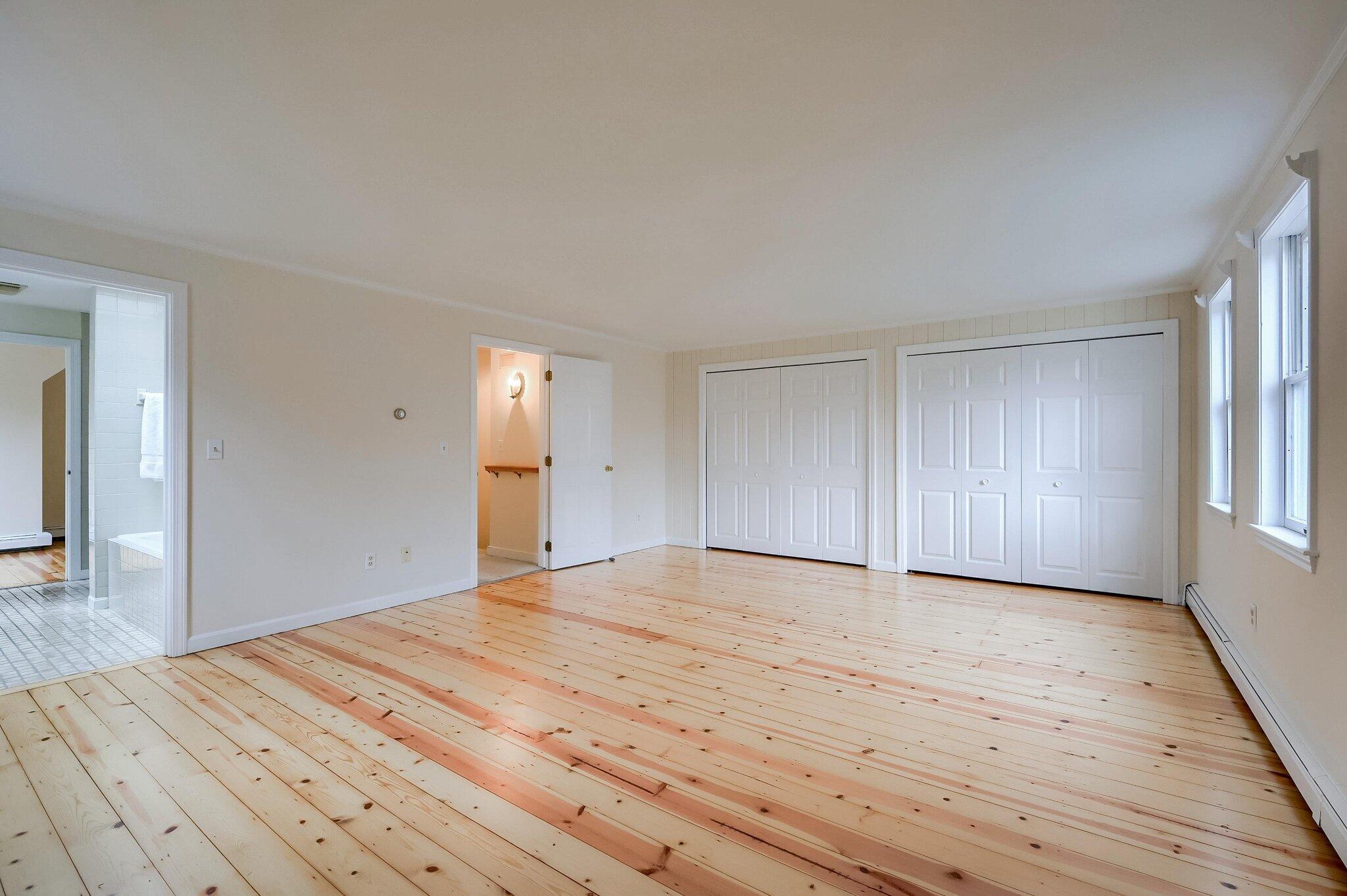 40 Barley Neck Road Orleans, MA 02653 - Photo 21 of 51 a view of empty room with wooden floor and fan
