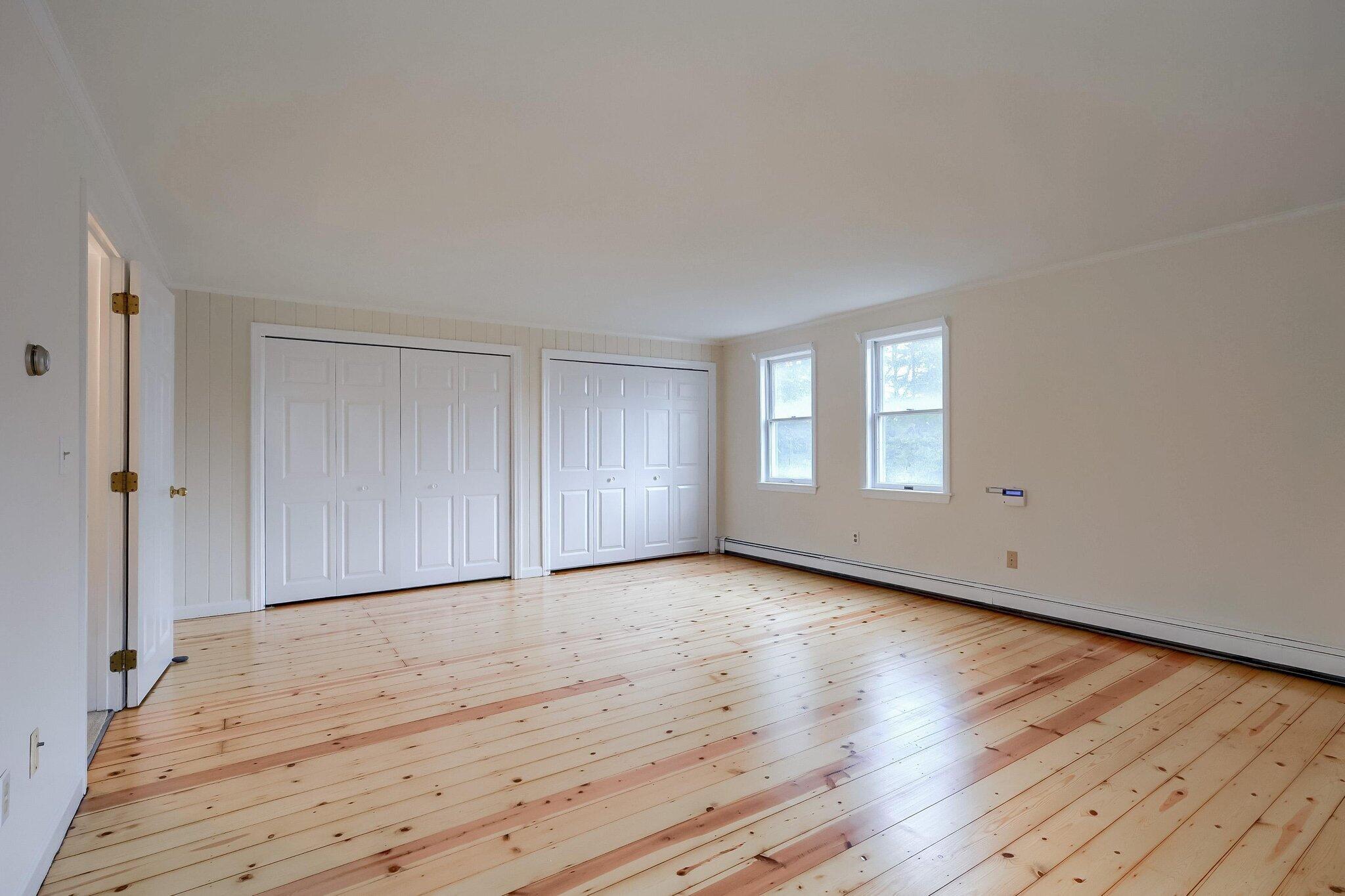 40 Barley Neck Road Orleans, MA 02653 - Photo 22 of 51 a view of an empty room with wooden floor and window
