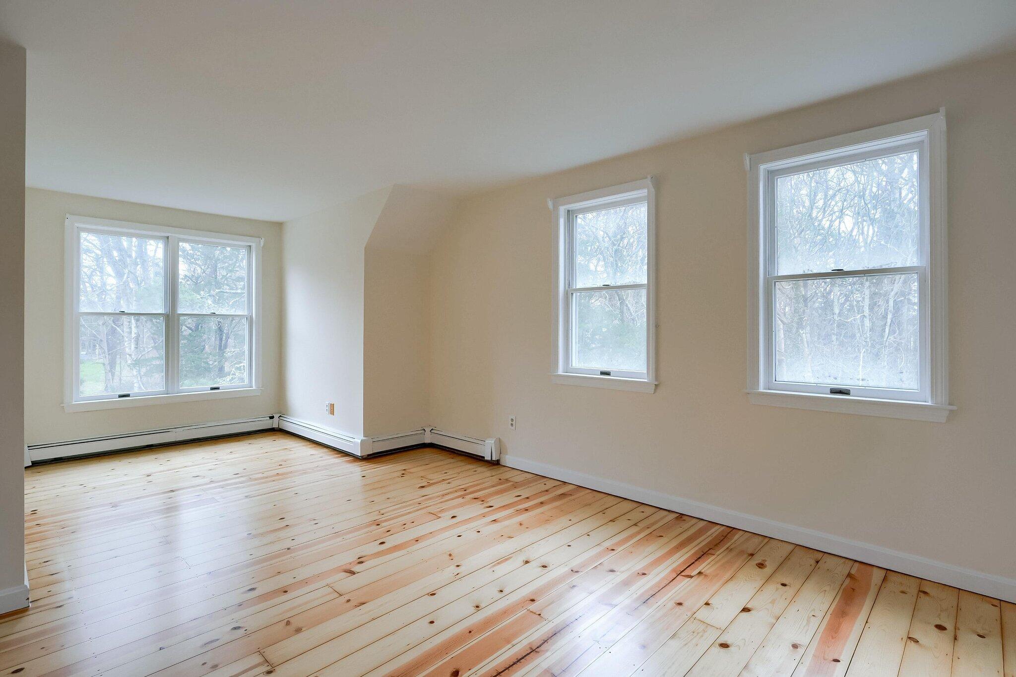 40 Barley Neck Road Orleans, MA 02653 - Photo 23 of 51 a view of an empty room with wooden floor and a window