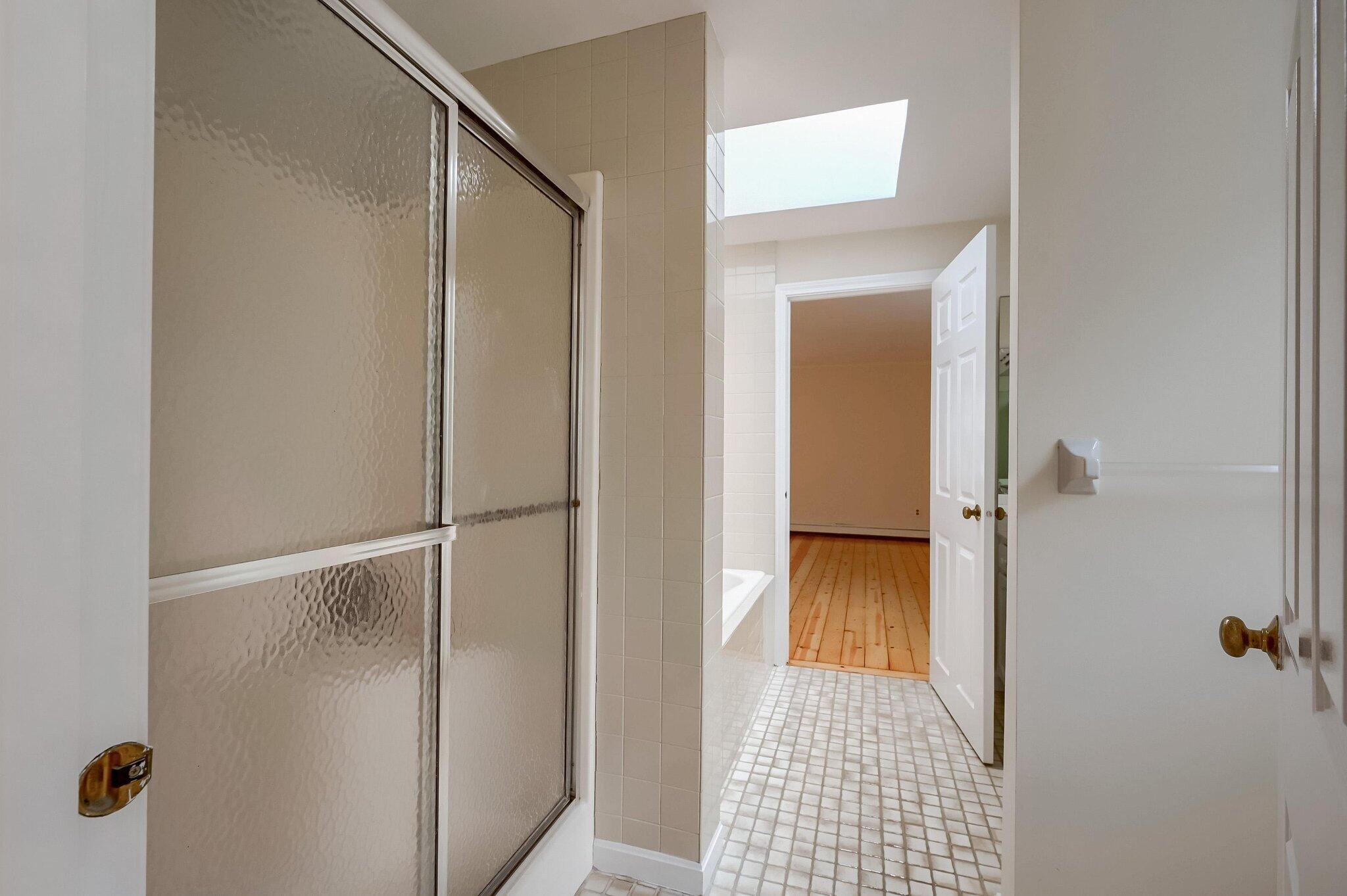 40 Barley Neck Road Orleans, MA 02653 - Photo 26 of 51 a bathroom with a glass shower door