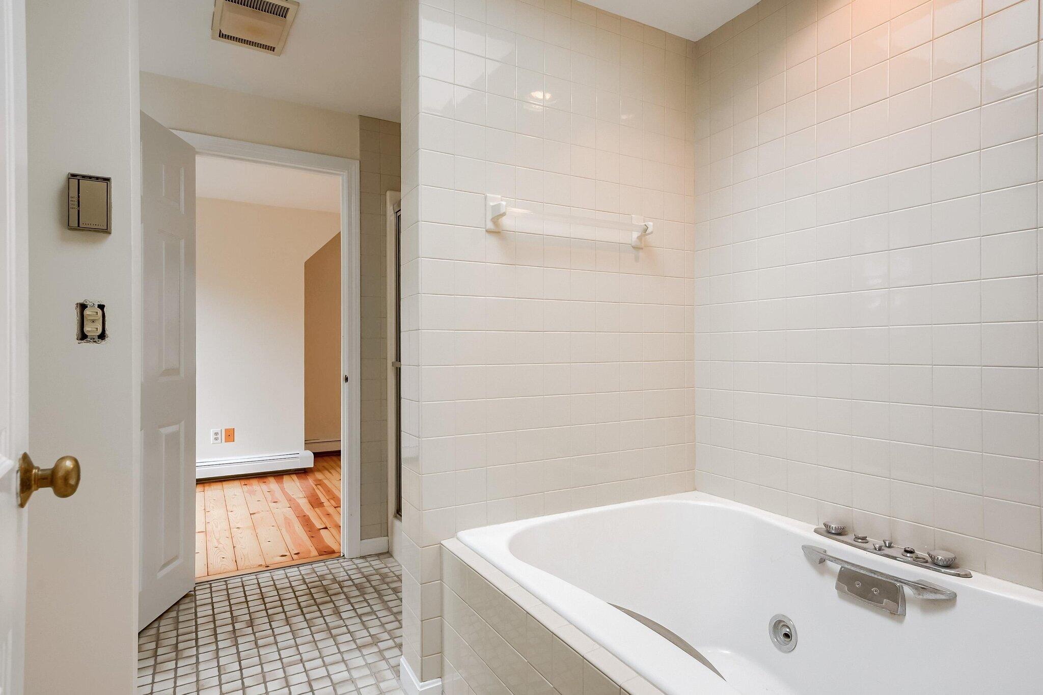 40 Barley Neck Road Orleans, MA 02653 - Photo 28 of 51 a bathroom with a tub and a shower