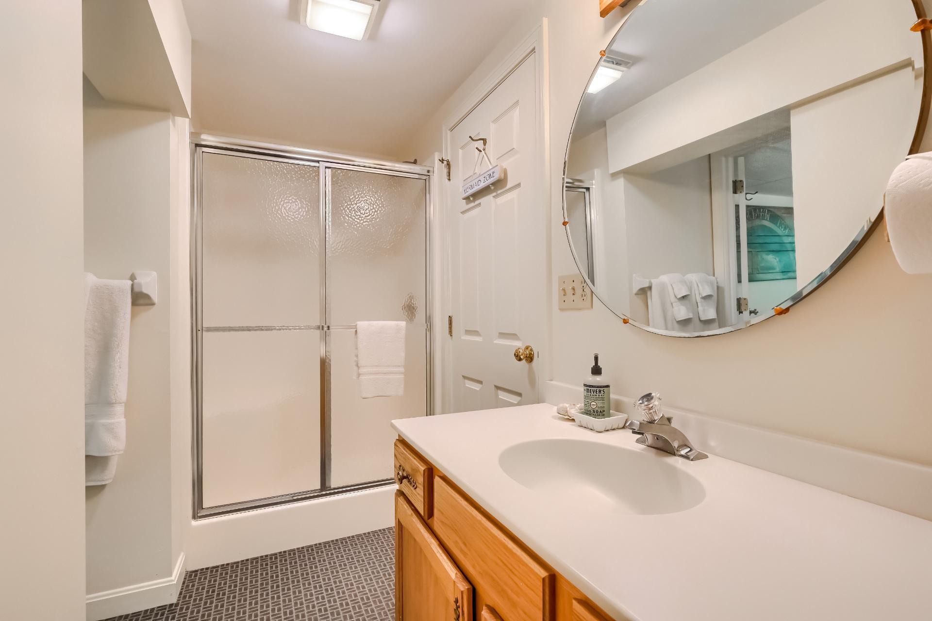 40 Barley Neck Road Orleans, MA 02653 - Photo 32 of 51 a bathroom with a sink vanity mirror and a shower