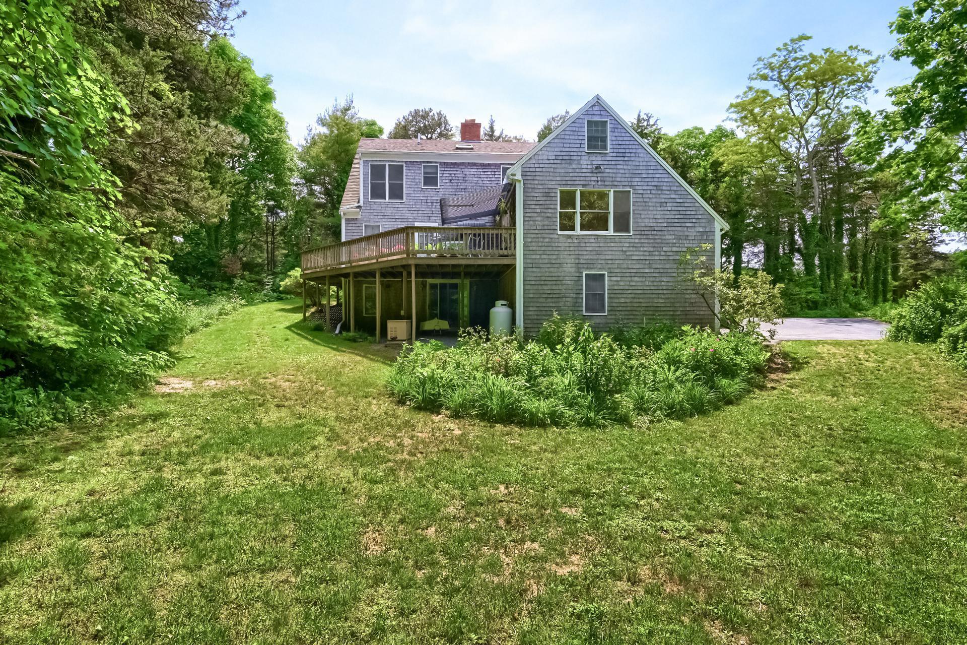 40 Barley Neck Road Orleans, MA 02653 - Photo 46 of 51 a front view of a house with a garden