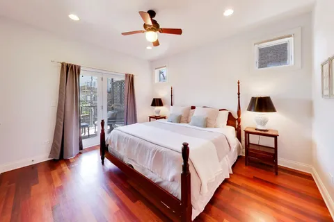 a bed room with a bed and a window