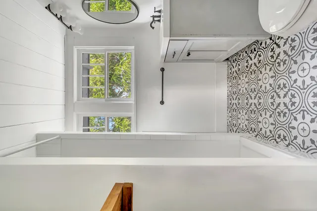 a bathroom with a bathtub and a shower
