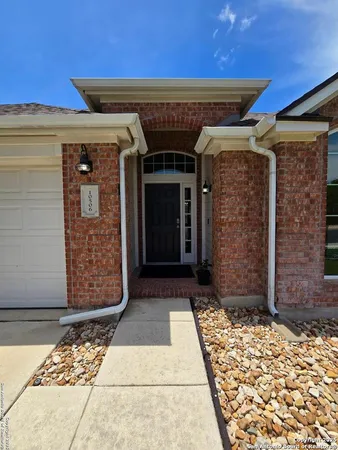 an entrance to house with yard