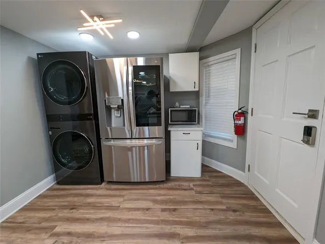 a view of a hallway with washer and dryer