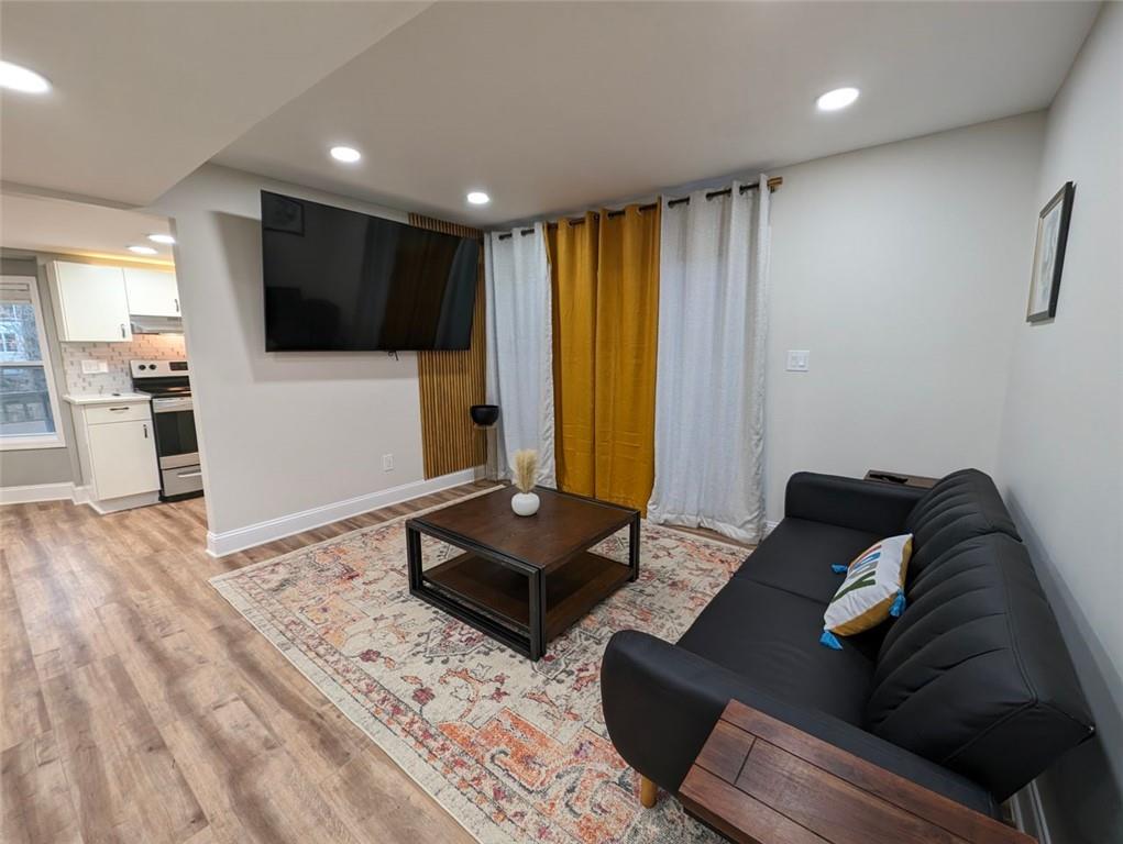 1303 Colony Drive, Unit C Marietta, GA 30068 - Photo 15 of 18 a living room with furniture and a flat screen tv