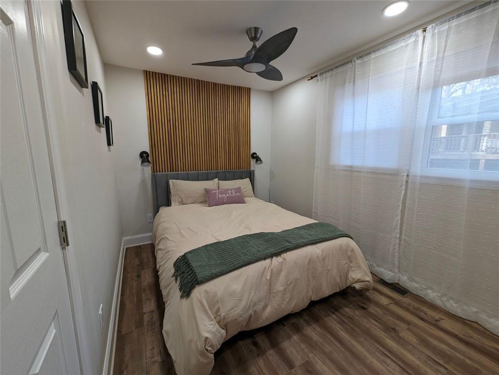 1303 Colony Drive, Unit C Marietta, GA 30068 - Photo 2 of 18 a bedroom with a bed and a window