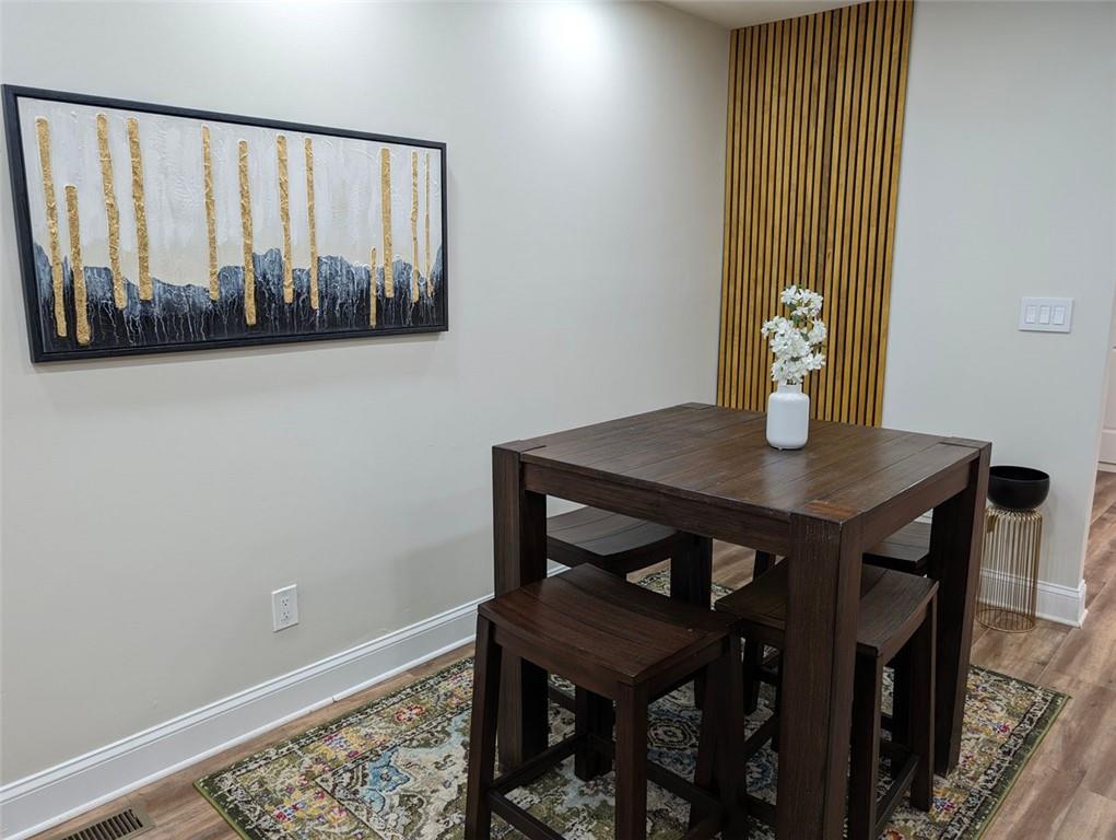 1303 Colony Drive, Unit C Marietta, GA 30068 - Photo 7 of 18 a view of a room with furniture and wooden floor