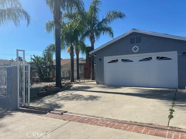 12729 Judd Street Pacoima, CA 91331 - Photo 2 of 14 a front view of a house with a yard