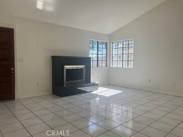 12729 Judd Street Pacoima, CA 91331 - Photo 4 of 14 a view of an empty room with a fireplace and a window