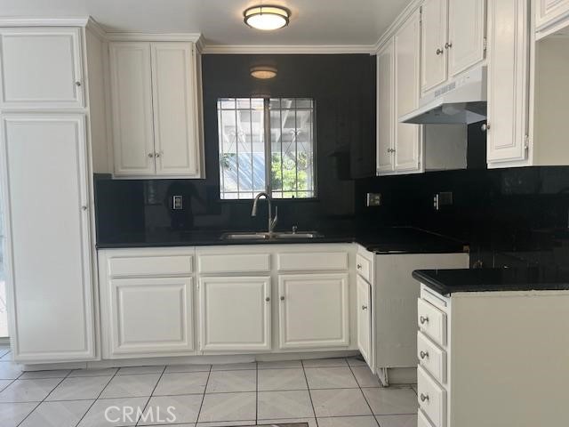 12729 Judd Street Pacoima, CA 91331 - Photo 8 of 14 a kitchen with white cabinets