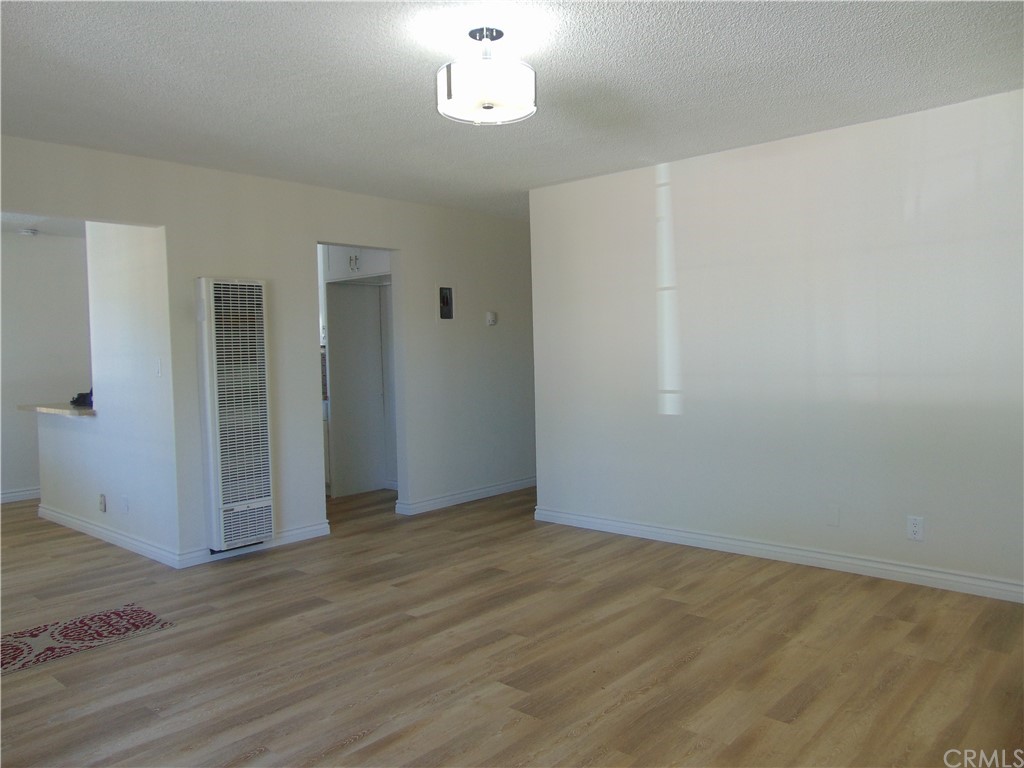 420 West 67th Way Long Beach, CA 90805 - Photo 12 of 21 an empty room with wooden floor and window