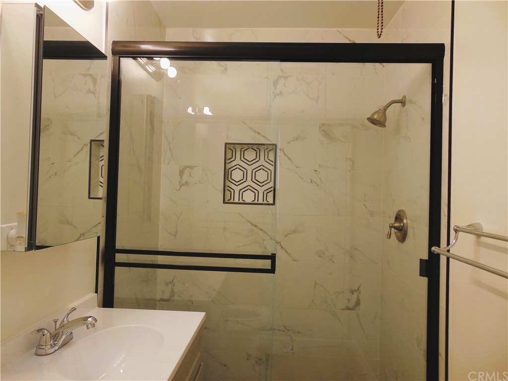 420 West 67th Way Long Beach, CA 90805 - Photo 20 of 21 a bathroom with a sink and a mirror