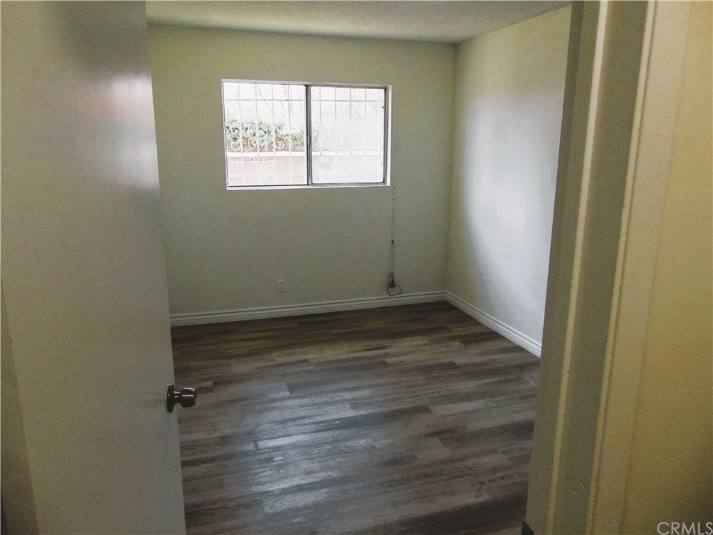 420 West 67th Way Long Beach, CA 90805 - Photo 6 of 21 an empty room with a window