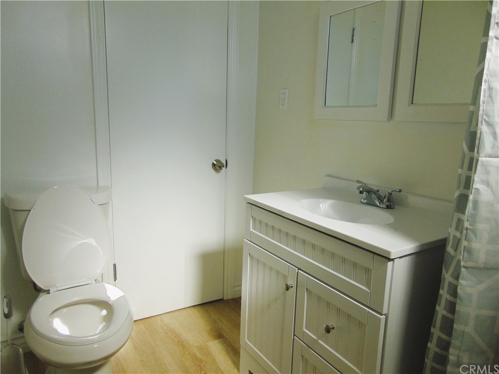 420 West 67th Way Long Beach, CA 90805 - Photo 9 of 21 a bathroom with a sink toilet and a mirror
