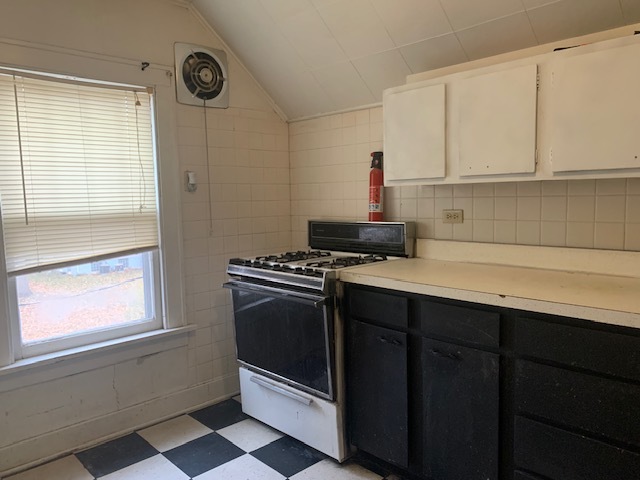 514 Marcy Street Ottawa, IL 61350 - Photo 34 of 54 a kitchen with stainless steel appliances a stove a sink and a microwave