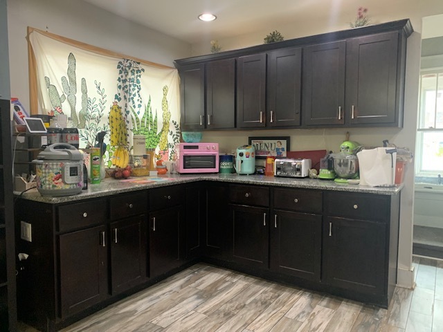 514 Marcy Street Ottawa, IL 61350 - Photo 5 of 54 a kitchen with granite countertop wooden cabinets and sink